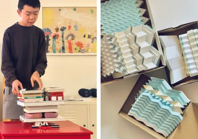 Miles Wu with a collection of origami