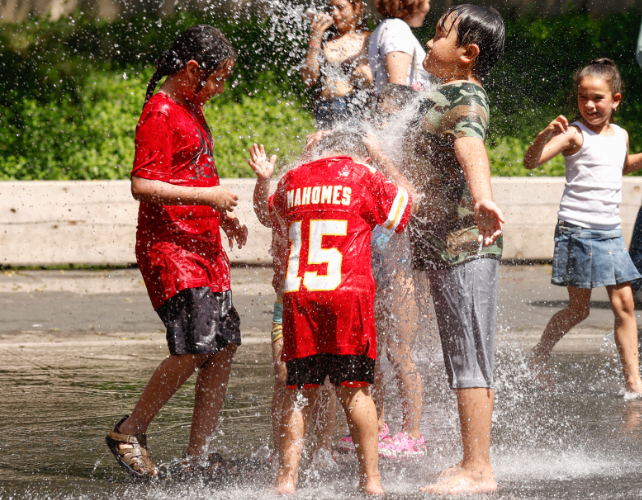 children playing in fountains