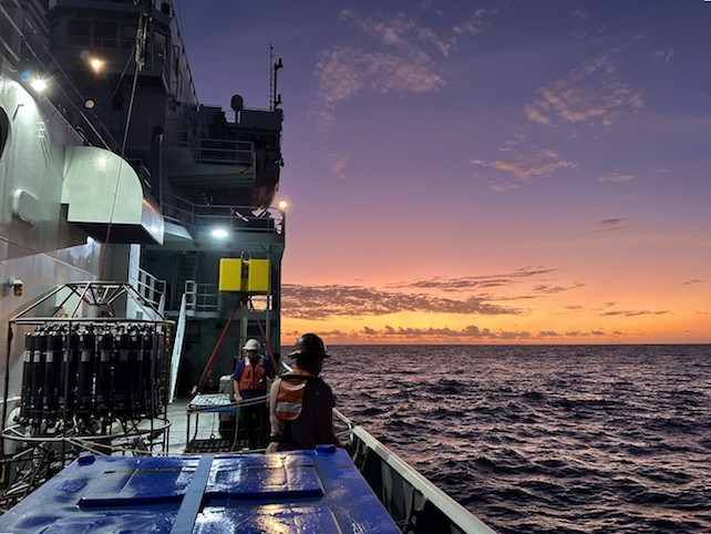 A sunset view from the Thomas G. Thompson research vessel as it carries equipment for monitoring photosynthetic cyanobacteria.