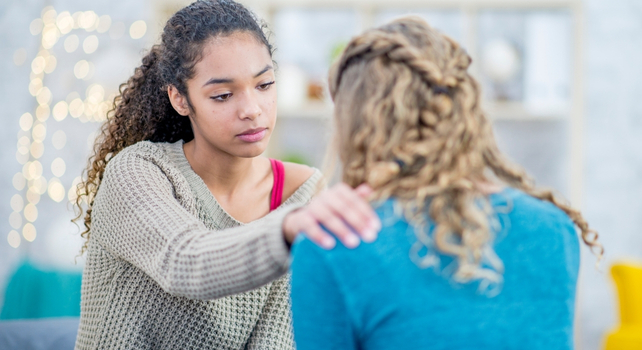 woman consoling her friend