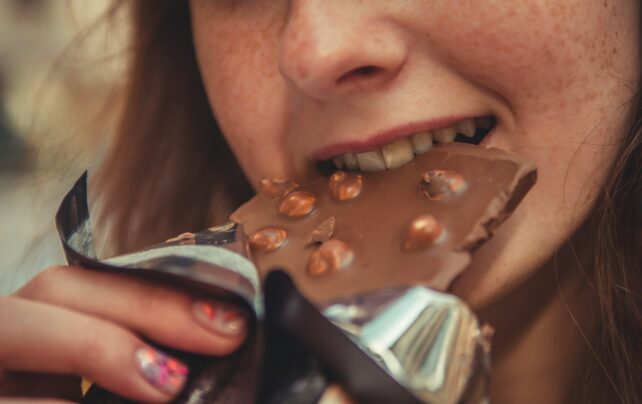 Close up of women eating chocolate 