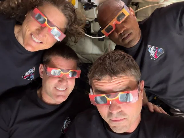 Artemis II crew wearing eclipse glasses