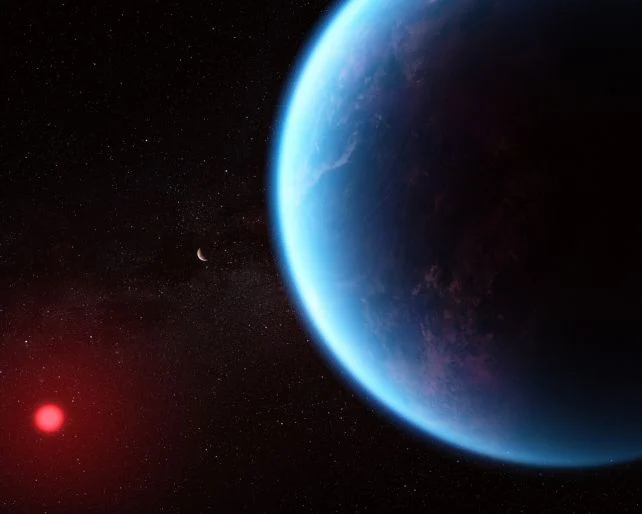Artist's illustration of exoplanet K2-18b as a large blue planet in space, with a small moon-like object nearby and a red star glowing in the distance.